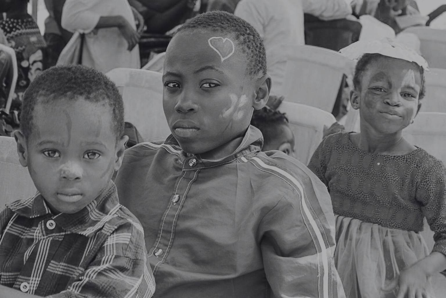 Children seated at an event