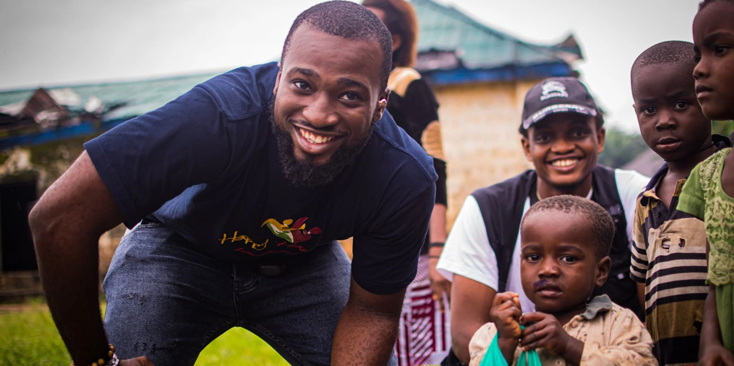 Volunteer with children in community